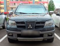Реснички на фары MITSUBISHI OUTLANDER 2003-2006